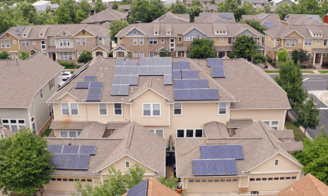 arial view of neighborhood with solar panels