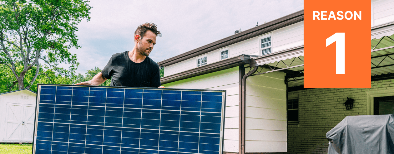 Homeowner carries a do it yourself module across his backyard